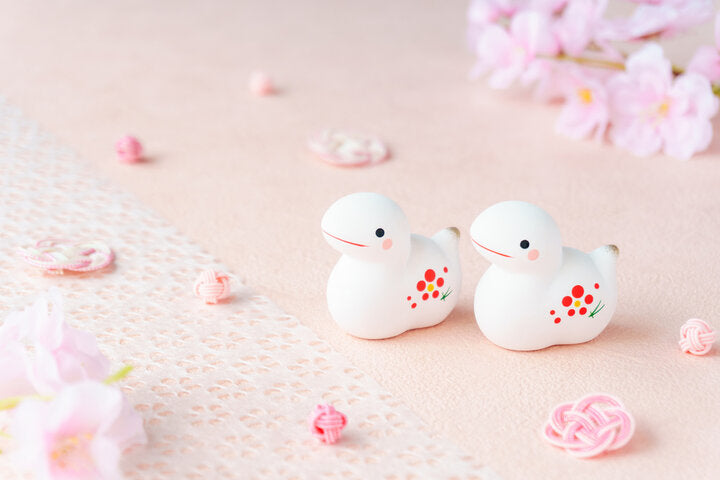 Year of the snake ornaments with sakura decorations for Japanese New Year