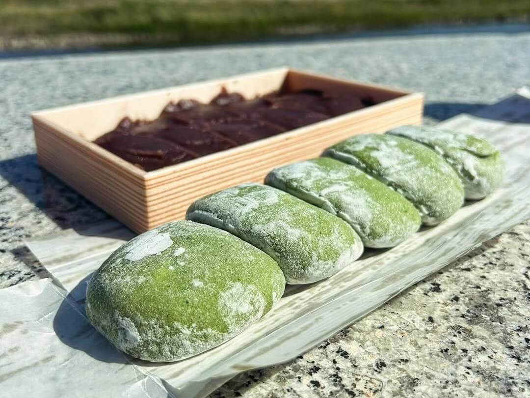 Green Mochi Next to a box of Red Bean Paste