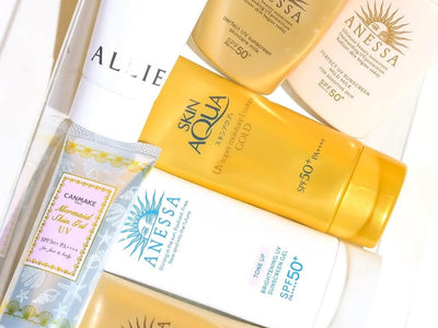 Several bottles of Japanese sunscreen arranged on a tray